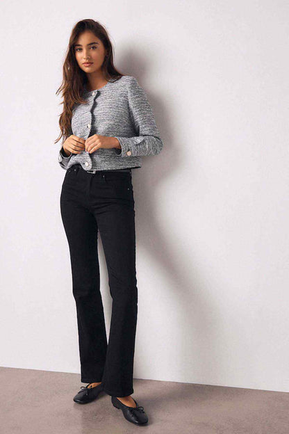 Black high-rise flared jeans with front button and zipper