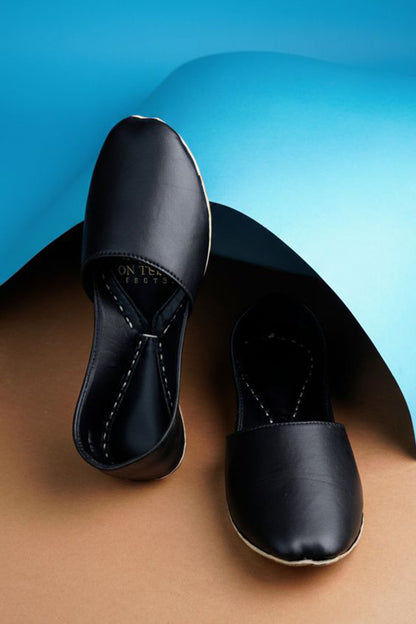 Pair of black slip-on flats with cushioned sole and rounded toe