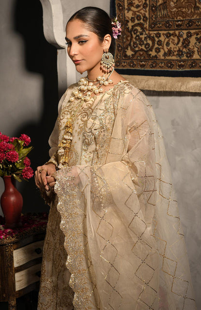 Cream embroidered long tunic with sheer dupatta and ornate neckline with gold tassels