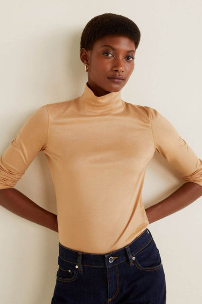 Beige long-sleeve turtleneck top, front view