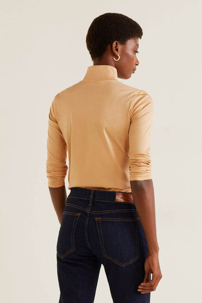 Beige long-sleeve turtleneck top, back view