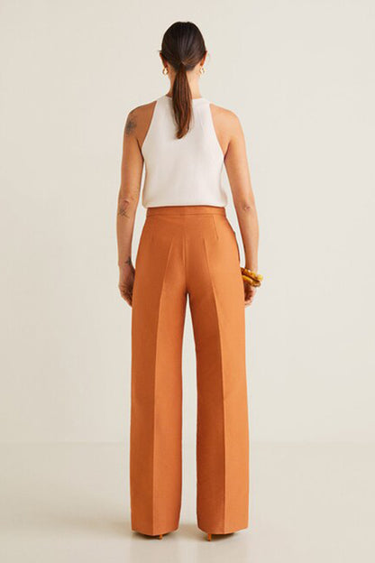 Orange high-waist wide-leg trousers with white halter crop top