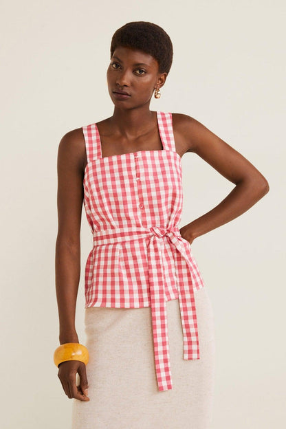 Red gingham peplum top with square neckline, front buttons, and tie waist sash