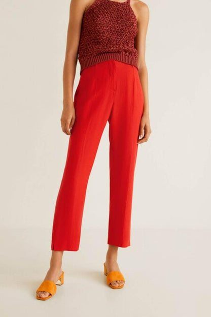 Coral red sleeveless knit top with matching ankle-length trousers, front view