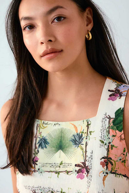 NEXT sleeveless dress close-up of ecru neckline with green botanical patchwork print