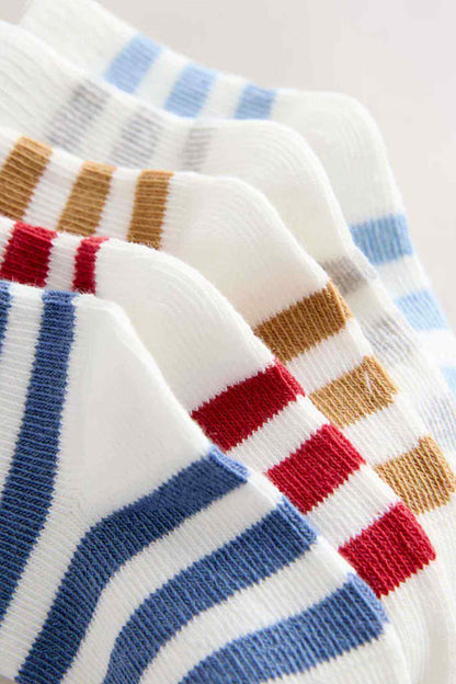 Striped sock cuff detail with blue, tan, red and white bands