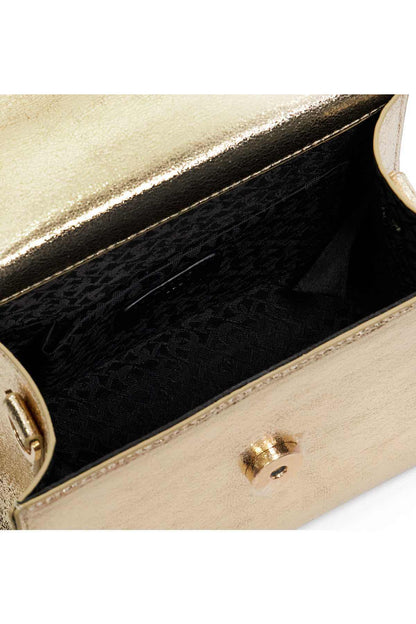 Gold mini handbag open interior with black lining and top clasp closure hardware