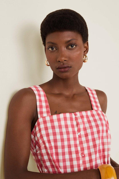 Red gingham square-neck top with front buttons and tie waist, close-up