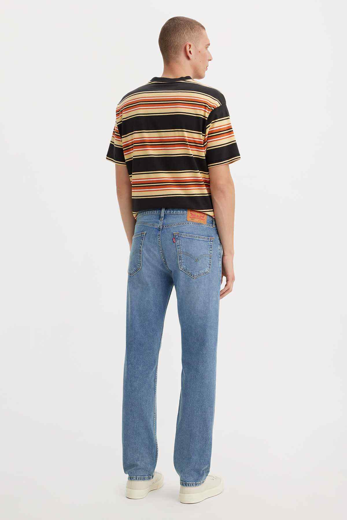 Medium-wash denim jeans, back view, five-pocket design with belt loops and straight leg