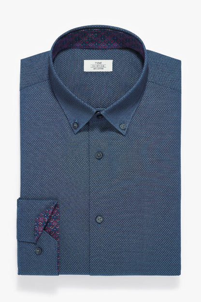 Blue button-down dress shirt with red patterned under-collar and button-cuff detail