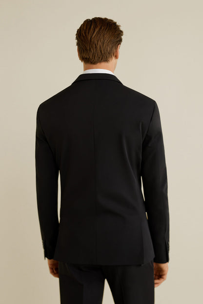Men’s black suit jacket, back view with tailored shoulders and center seam