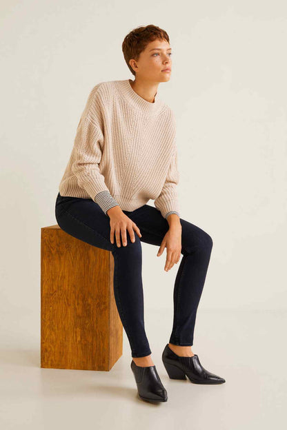 Beige chunky knit crewneck sweater with wide sleeves and ribbed cuffs