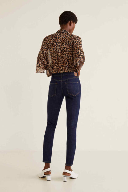 Back view of leopard-print blouse and dark blue slim jeans