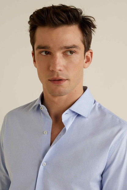 Light blue patterned dress shirt collar with button placket and long sleeves