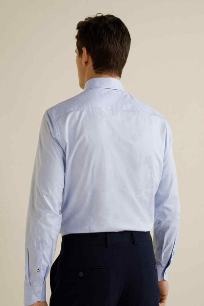 Light blue dress shirt back view with long sleeves and buttoned yoke