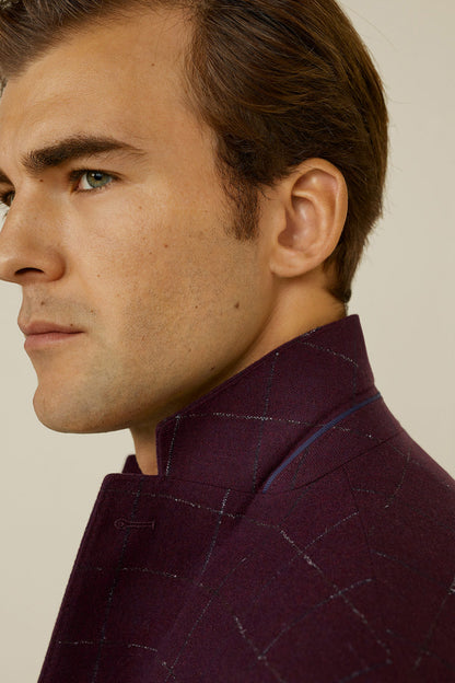 Men's burgundy check blazer neckline close-up with structured collar and lapel