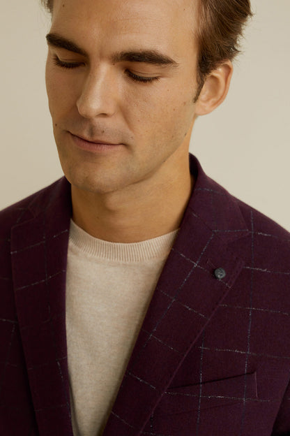 Men's burgundy check blazer close-up: lapel and chest pocket detail