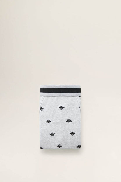 Grey boxer brief with dark waistband, folded view, small black spider print