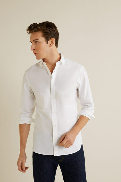 Men's white button-up shirt with collar and long sleeves, front 3/4 view