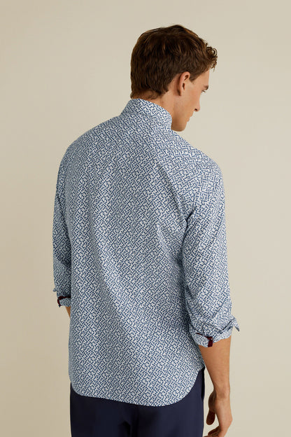 Men's light blue patterned button-up shirt, back view with rolled cuffs
