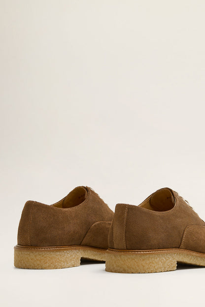 Dark brown suede lace-up shoes, side and heel view, tan cushioned sole