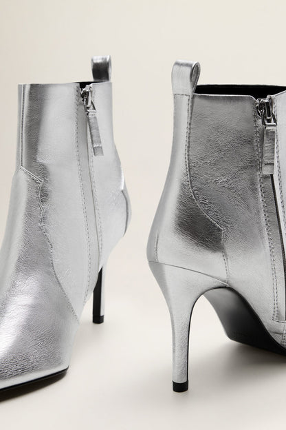 Silver heeled ankle boots with side zipper and pointed toe