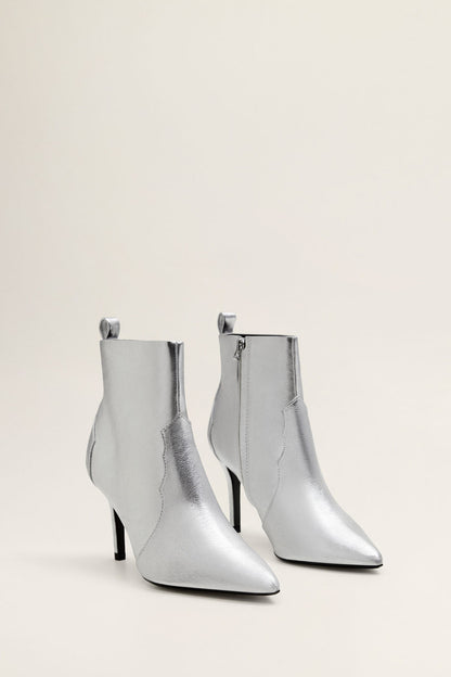 Pair of silver ankle boots with side zipper and slim stiletto heels