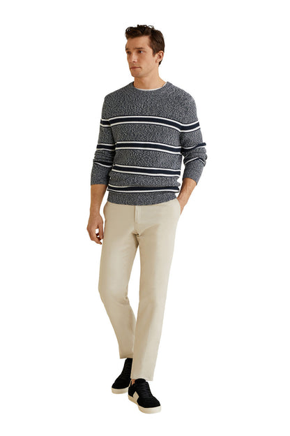 Full view dark knit sweater with white and navy horizontal stripe bands