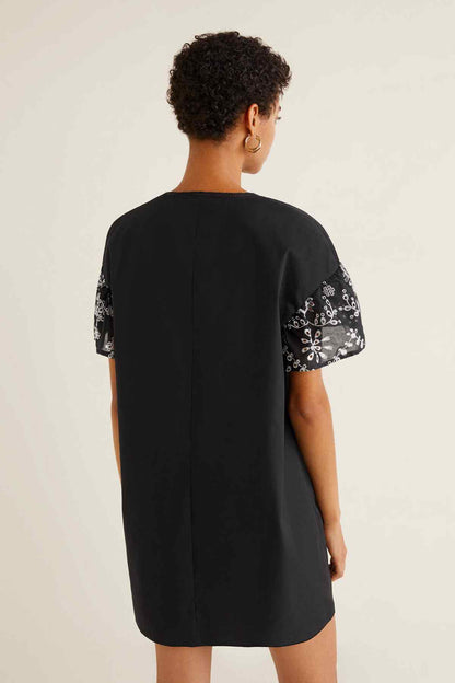 MANGO black tunic dress, back view, short sleeves with embroidered floral trim