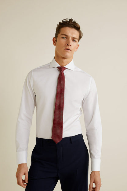 White button-up dress shirt with long sleeves and spread collar