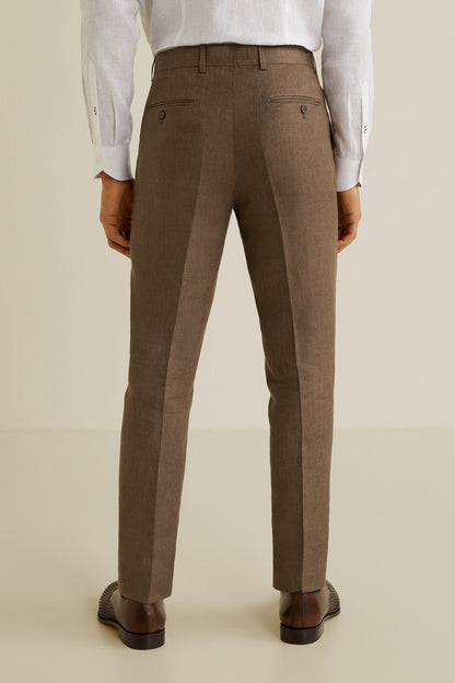 Men's brown tailored trousers with pressed creases, belt loops, ankle-length