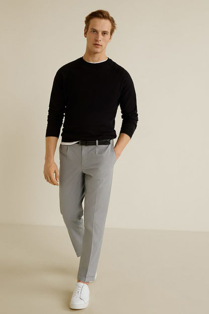 Light grey straight-leg trousers with cuffed hems and belt loops