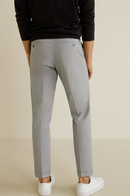 Light grey trousers, back view, with belt loops and stitched leg seams