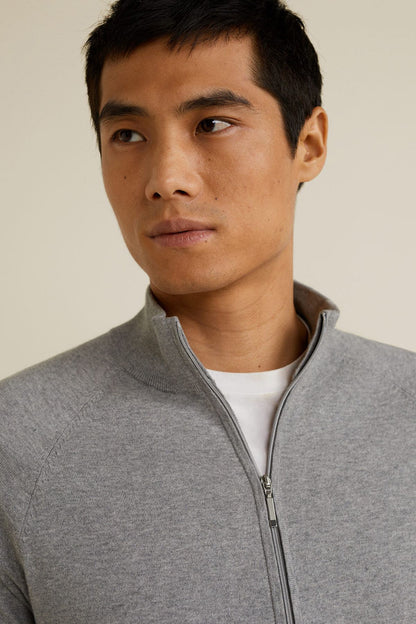 Men's heather gray zip-up jacket close-up of front zipper and stand collar