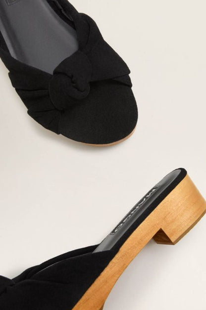 Black fabric knot mule sandal with wooden block heel and slip-on upper