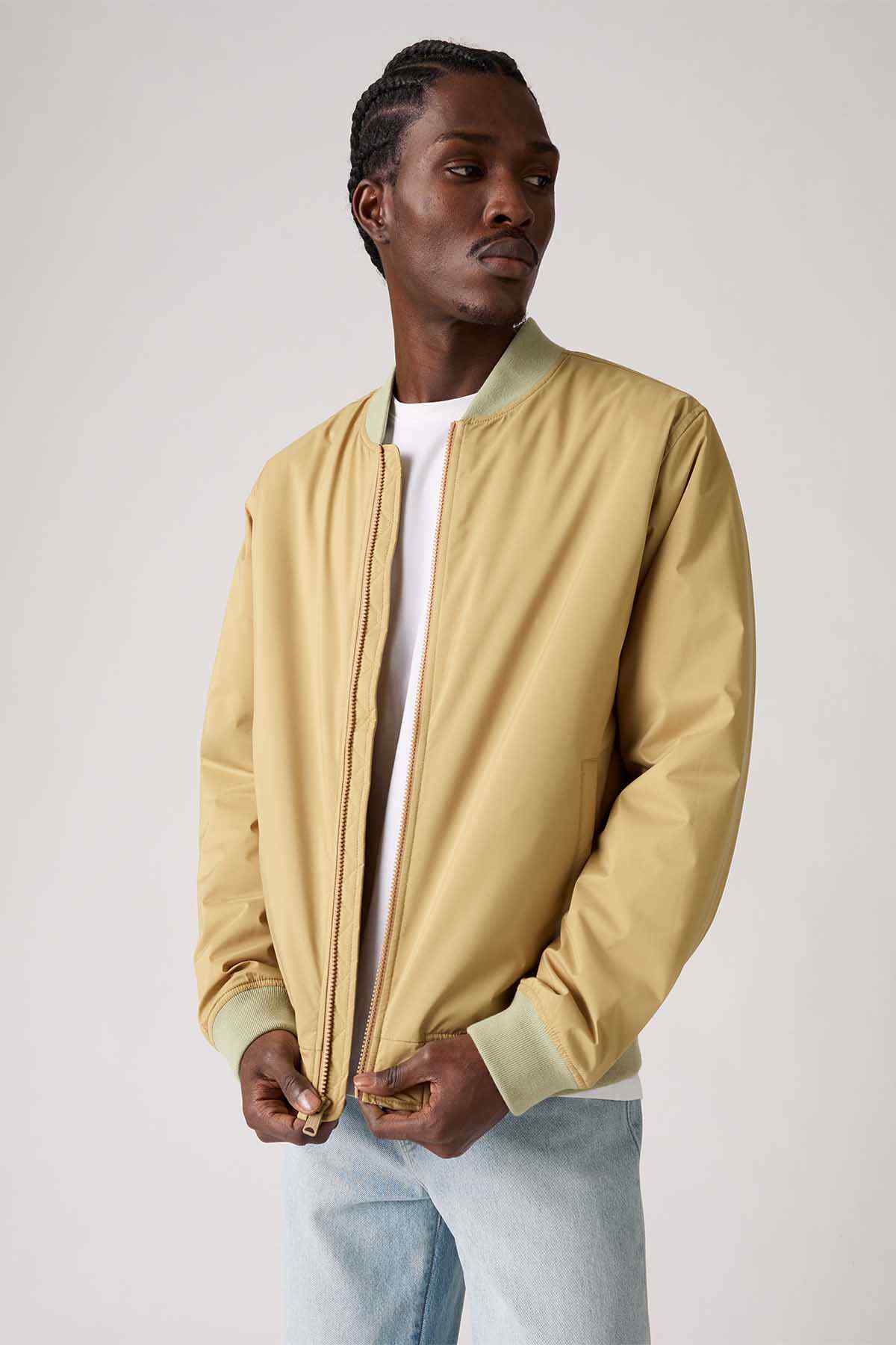 Men's tan zip-up bomber jacket with stand collar and ribbed cuffs