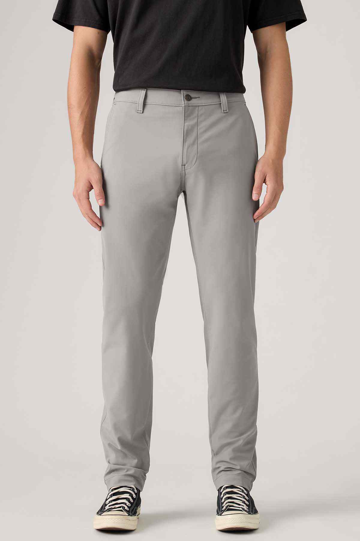 Men's grey jeans showing front pockets and straight leg