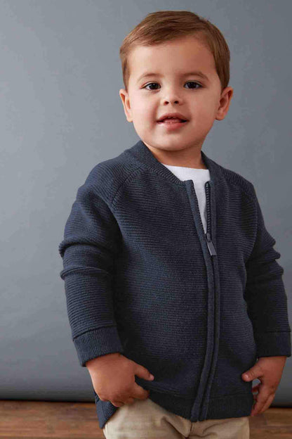 Navy zip-up knit jacket with long sleeves, front zipper, and side pockets