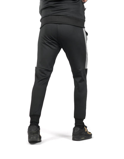 Bodybrics dark tapered pants with knee seam and elastic ankle cuffs