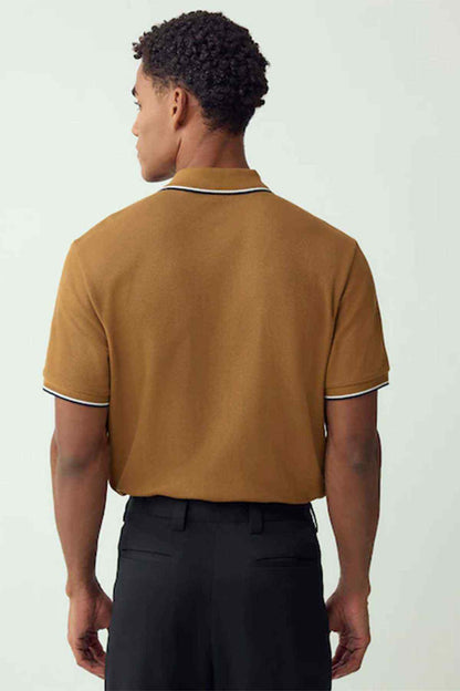 Tan polo shirt back view with white-and-navy collar trim, short sleeves