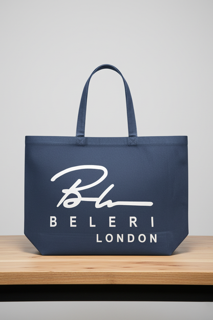 Indigo blue tote bag with white Beleri London logo and two top carry handles