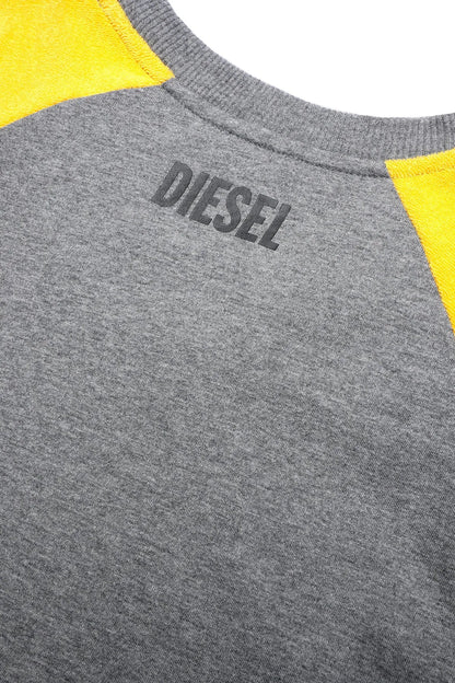 Grey T-shirt neckline with 'DIESEL' logo graphic and yellow raglan trim
