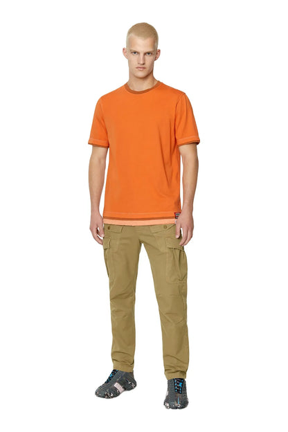Camel cargo pants worn view with belt loops and multiple cargo pockets