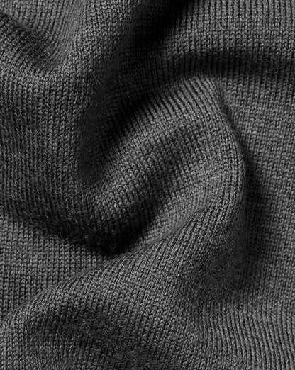 Grey wool turtleneck sweater sleeve texture and folded shoulder seam