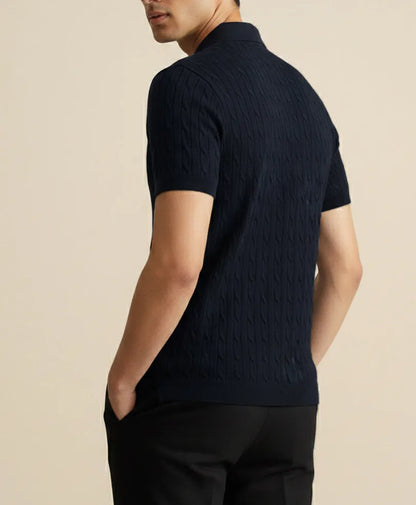 Navy textured knit polo shirt with short sleeves, showing knit pattern along side