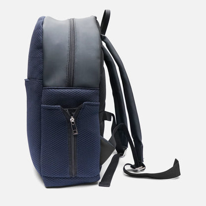 Navy and dark gray backpack with front zipper, top handle, and adjustable shoulder straps