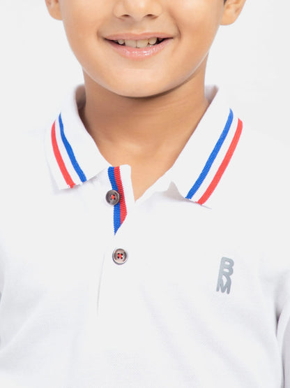 White polo shirt close-up with striped collar, two-button placket, small B logo