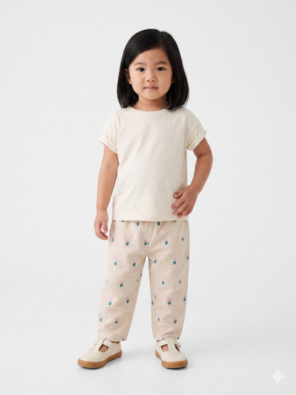 Cream kids' pants with teal and pink cactus print, elastic waistband
