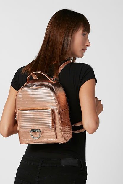 Pink rose-gold mini backpack worn on back, with front pocket and adjustable straps