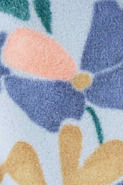 Printed plush fabric with multicolor flowers and yellow button on blue
